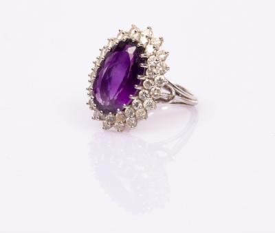 An amethyst and diamond oval