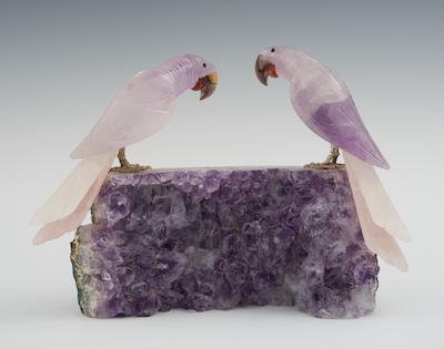 An Amethyst Geode with Two Carved