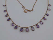 An amethyst necklace set in 9 carat