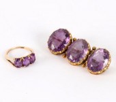 An amethyst three-stone brooch