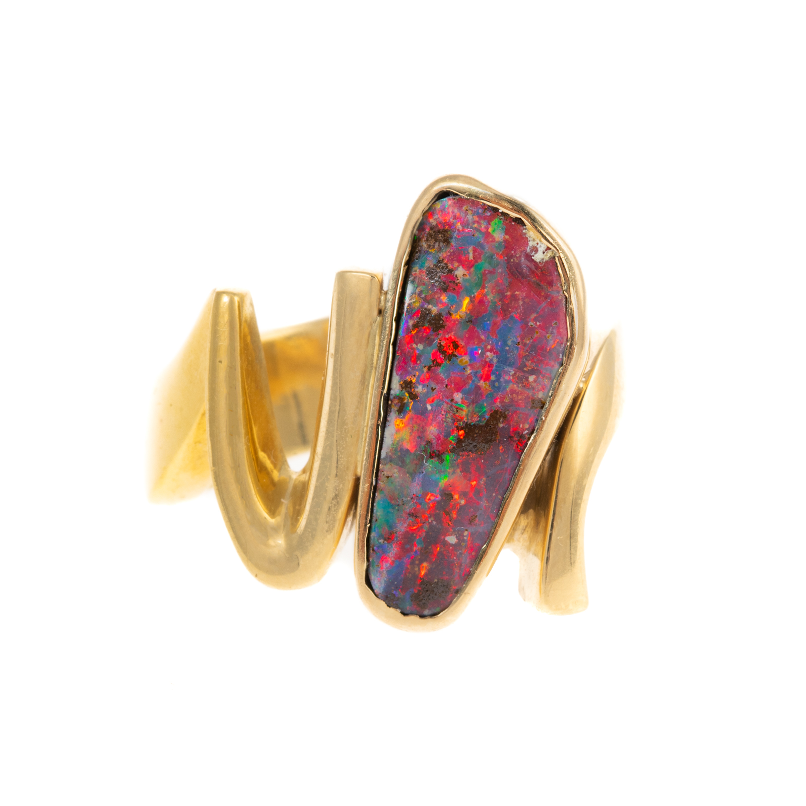 AN AMOEBA-SHAPED BLACK OPAL RING IN