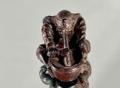 AN AMUSING PLUM WOOD SHUNGA NE