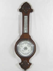 An aneroid wall barometer/