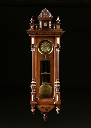 AN ANTIQUE BRASS AND CARVED
