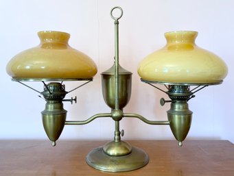An antique brass double student