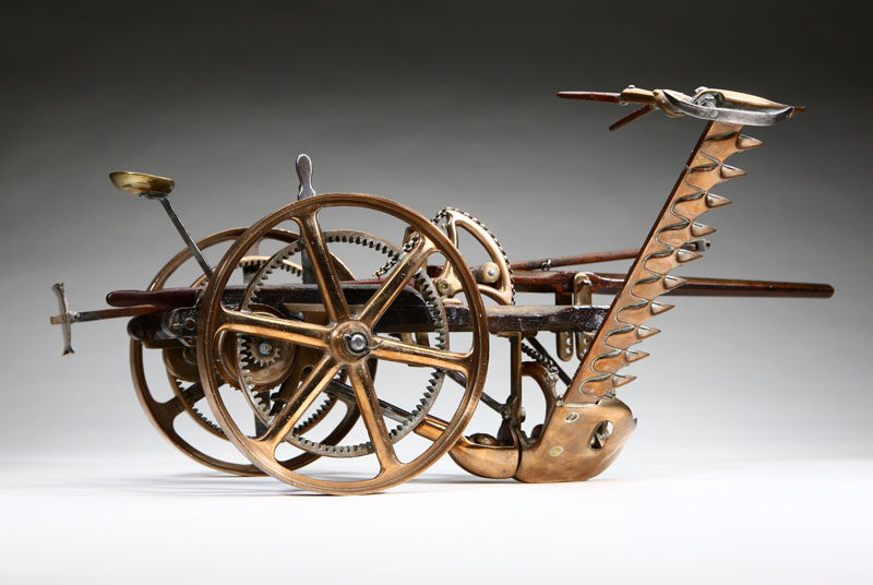 An antique brass walnut and steel
