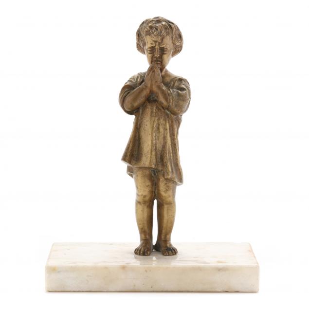 AN ANTIQUE BRONZE SCULPTURE OF A