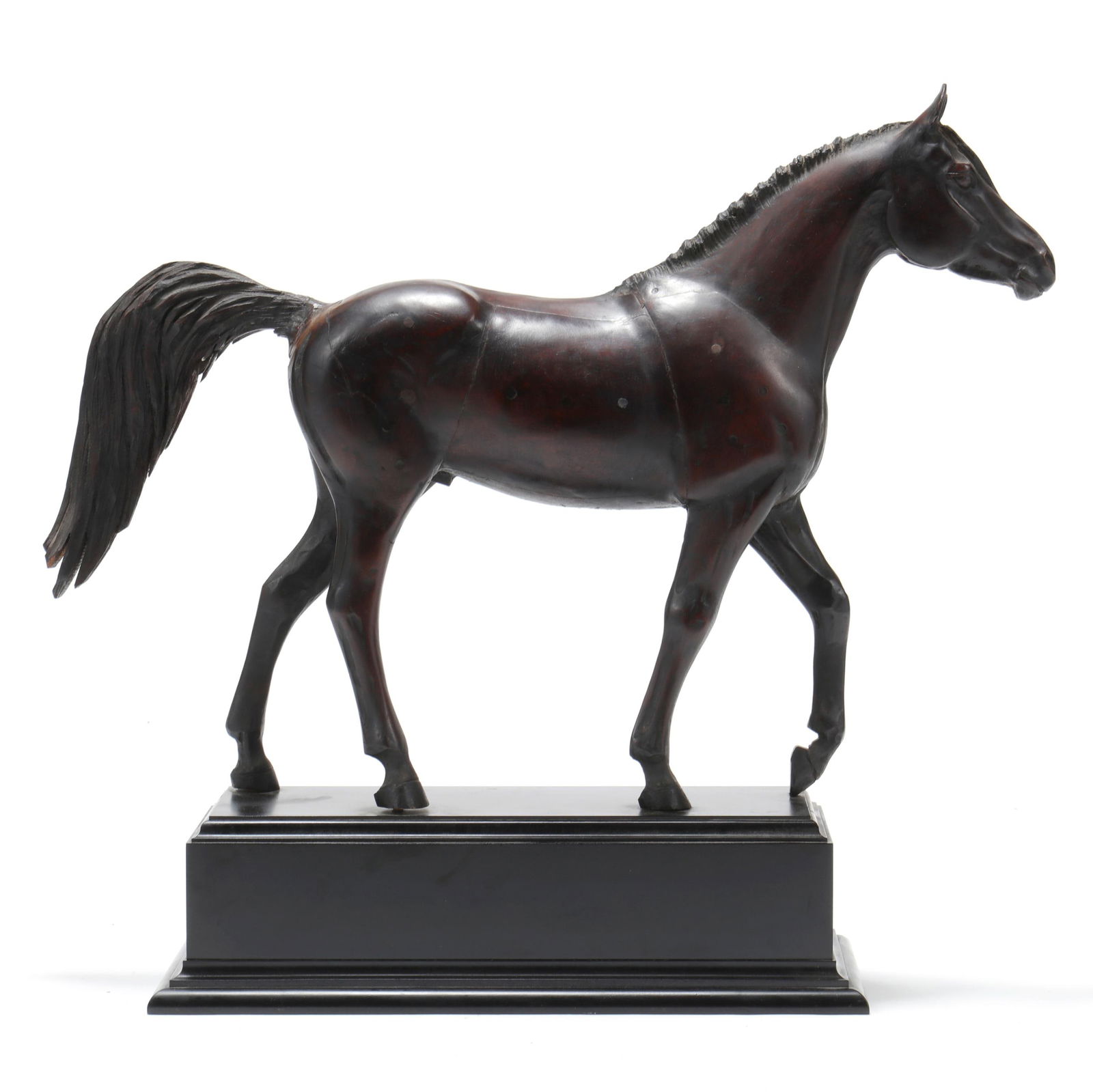 AN ANTIQUE CARVED MODEL OF A