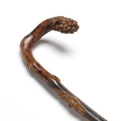 AN ANTIQUE CARVED WOOD WINE MA