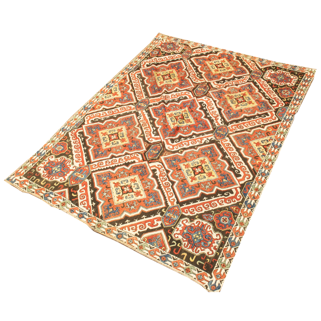 AN ANTIQUE CAUCASIAN CARPET An
