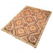 AN ANTIQUE CAUCASIAN CARPET An