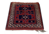 AN ANTIQUE CAUCASIAN CARPET<br