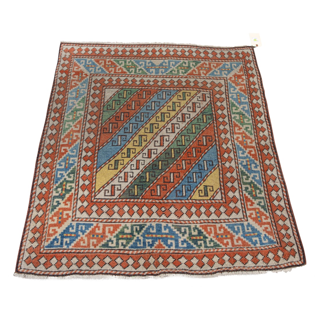 AN ANTIQUE CAUCASIAN CARPETAn