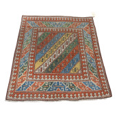 AN ANTIQUE CAUCASIAN CARPET<br