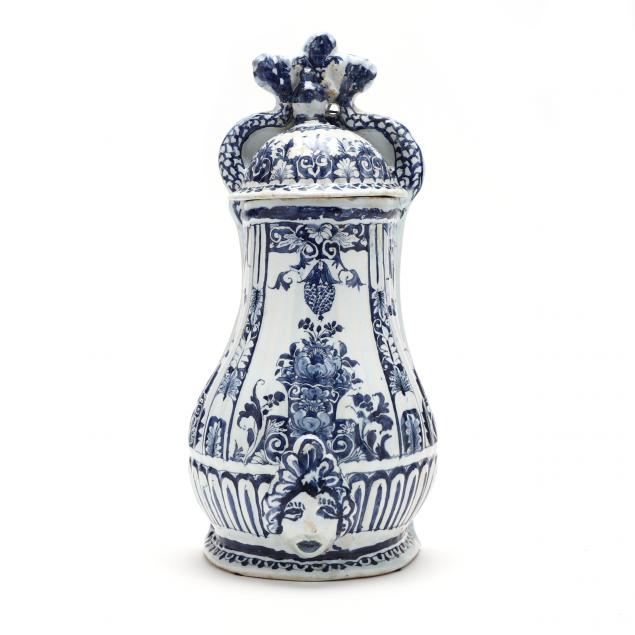 AN ANTIQUE DELFT WALL MOUNT WATER