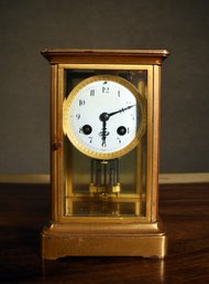 An antique gilt brass and glass