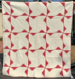 An antique hand stitched red and