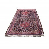 AN ANTIQUE KURDISH CARPET An a