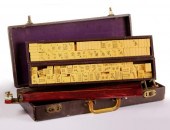 AN ANTIQUE MAH JONG SET WITH C