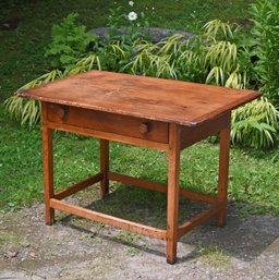 An antique maple and pine stretcher