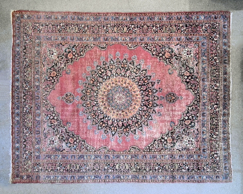 An Antique Meshad carpet woven in
