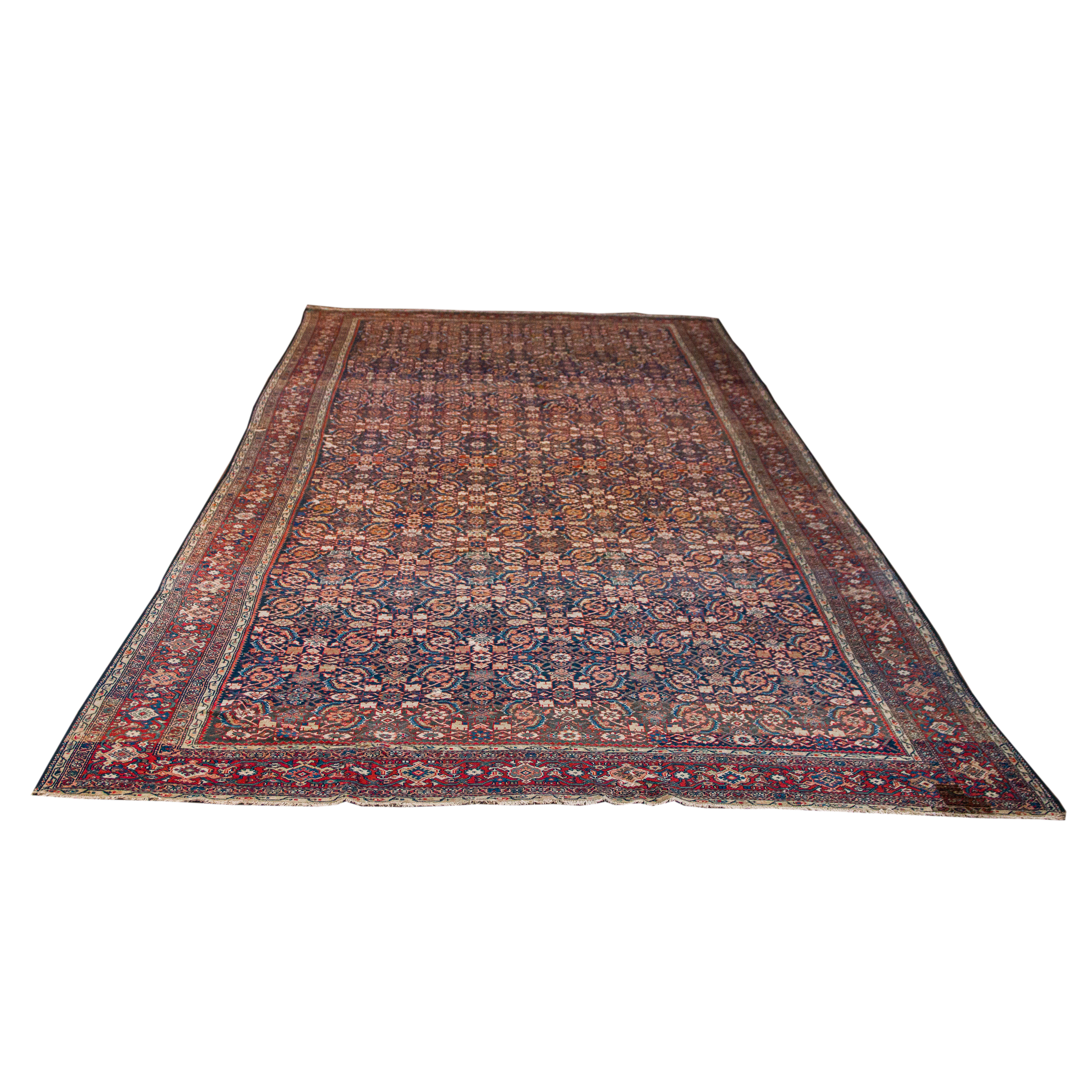 AN ANTIQUE NORTHWEST PERSIAN CARPET