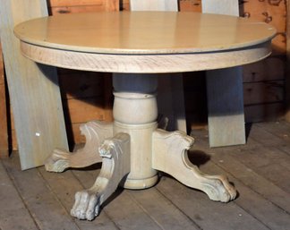 An antique oak dining table, in