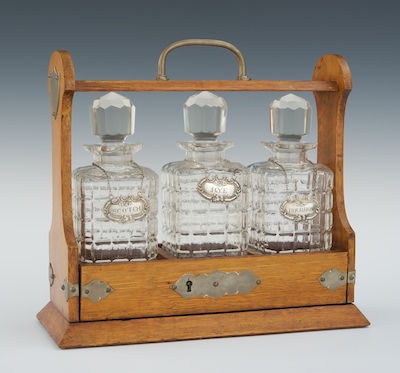 An Antique Oak Tantalus The locking