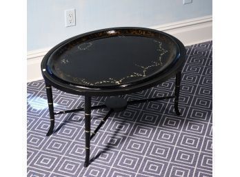 An antique oval papier mache