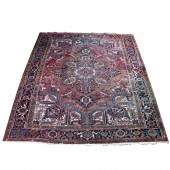 AN ANTIQUE PERSIAN HERIZ CARPE