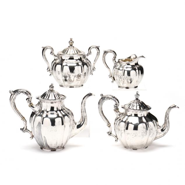 AN ANTIQUE STERLING SILVER TEA &