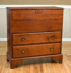An antique two-drawer lift top