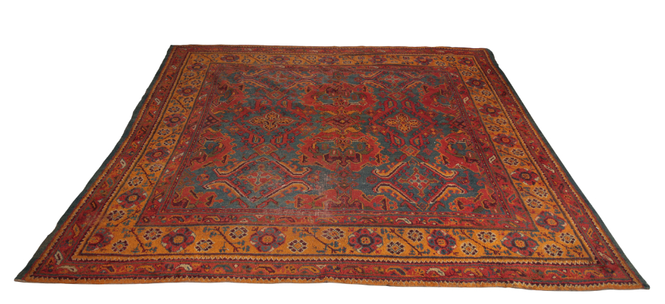 AN ANTIQUE USHAK CARPET woven in