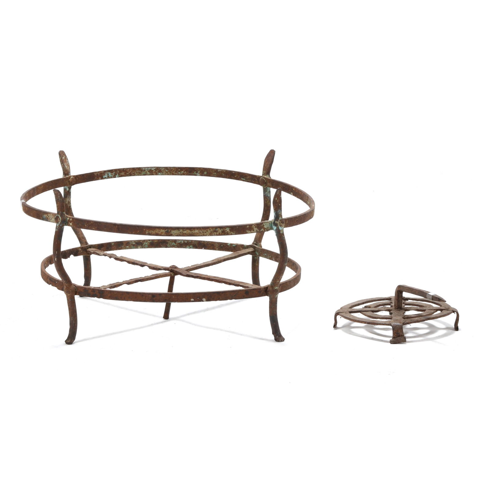 AN ANTIQUE WROUGHT IRON FIREPLACE