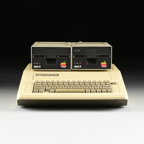 AN APPLE IIE COMPUTER WITH TWO DISK