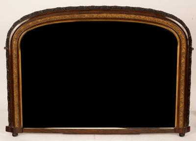 An arch framed overmantle mirror