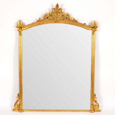 An arch-top gilded overmantel