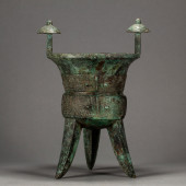AN ARCHAIC BRONZE RITUAL WINE