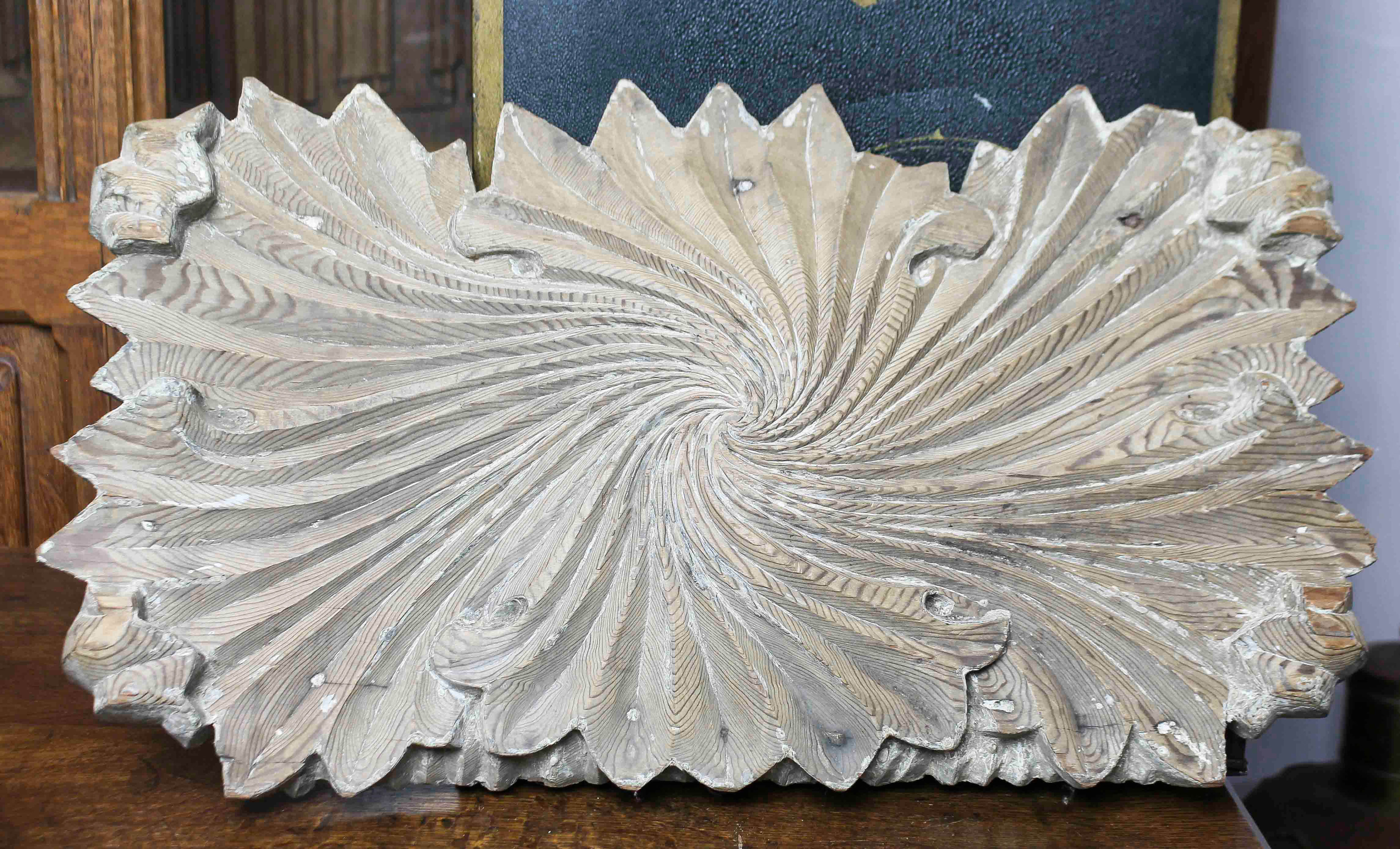 AN ARCHITECTURAL CARVED WOOD PANEL,