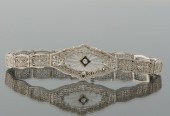 An Art Deco Gold Diamond and C