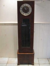An Art Deco longcase clock wit