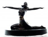 AN ART DECO PATINATED AND POLY