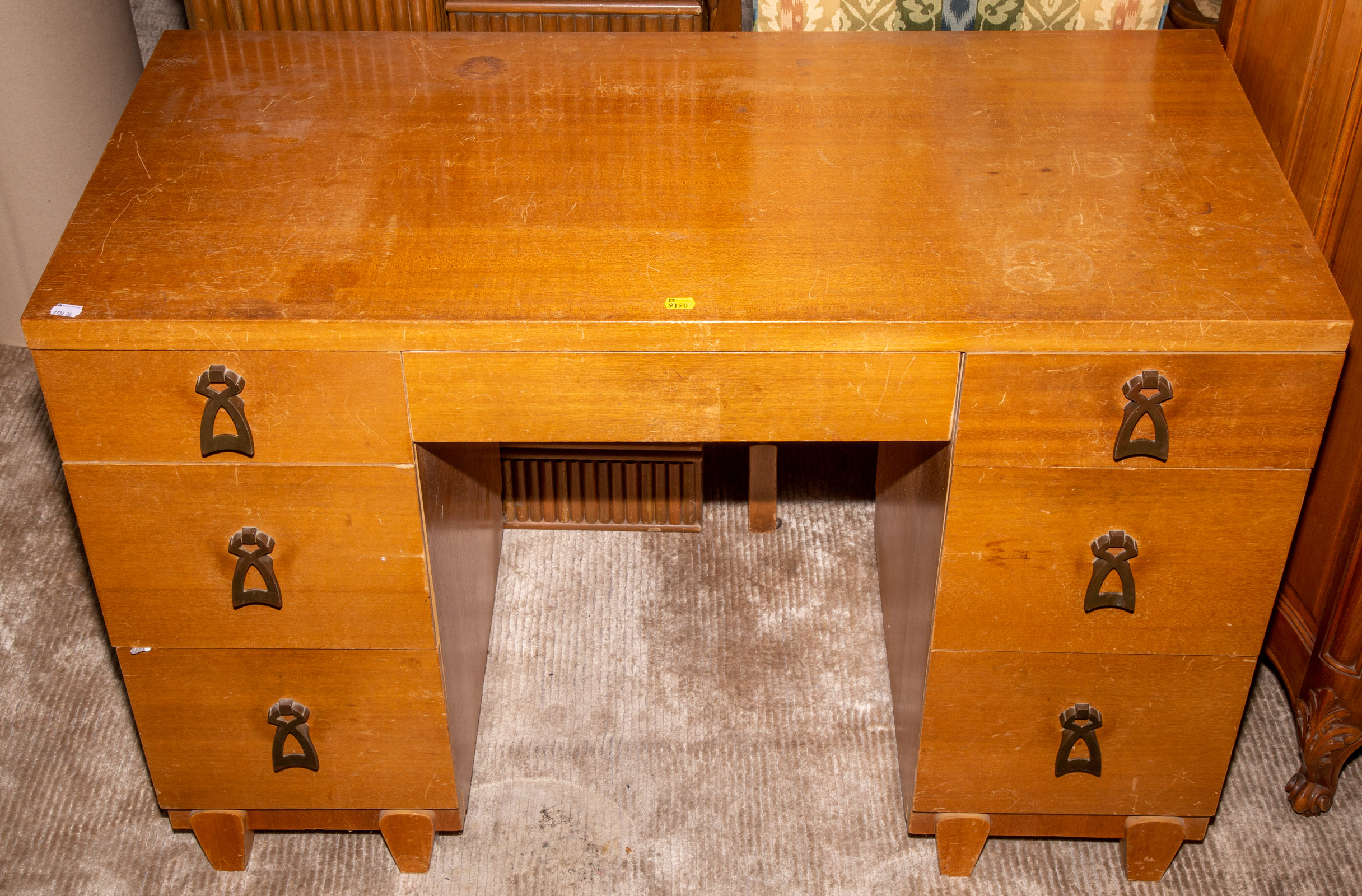 AN ART DECO STYLE MAHOGANY DESK .
