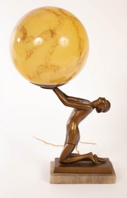 An Art Deco table lamp, a semi clad