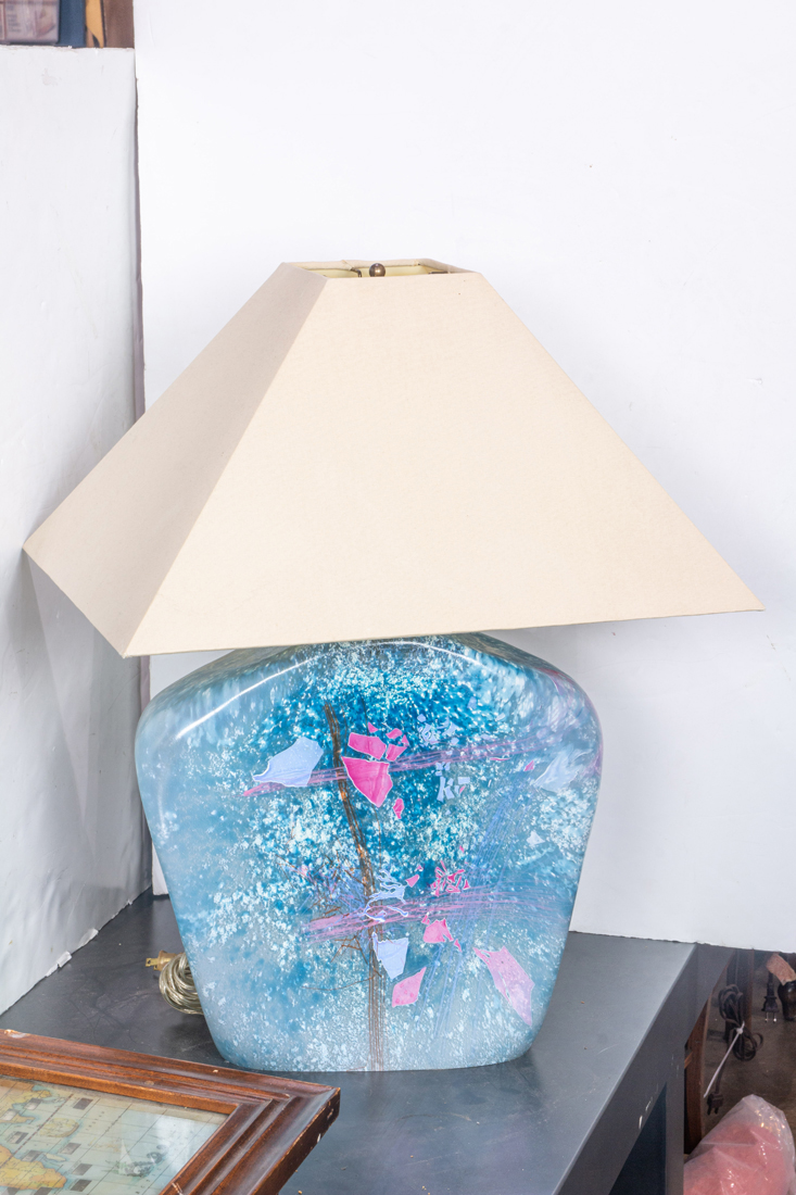 AN ART GLASS LAMP, THE SHOULDERED
