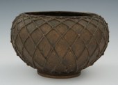 AN ART NOUVEAU BRONZE VASE MAD