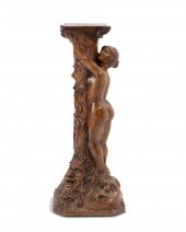 AN ART NOUVEAU CARVED WOOD PLA