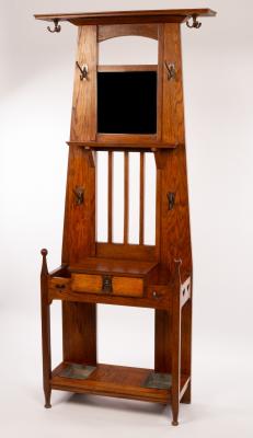 An Art Nouveau hall stand with coat