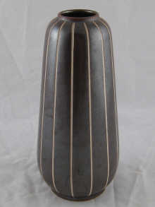 An art pottery vase incised marks