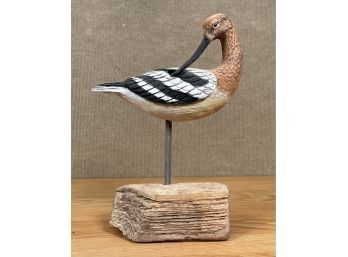 An artisan carved shorebird
